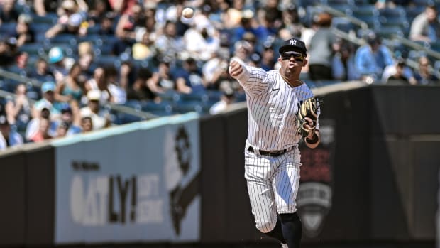 Jul 23, 2023; Bronx, New York, USA; New York Yankees third baseman Oswald Peraza (91) fields a ground ball and throws to first base for an out against the Kansas City Royals during the fourth inning at Yankee Stadium.